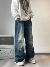 Men’s full size wash wide-leg jeans in faded blue denim with reinforced patchwork for a perfect fit and style