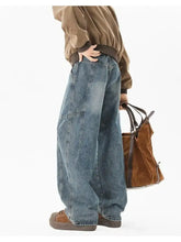 Men’s full size wash wide leg jeans in faded blue denim with visible stitching and cargo pockets