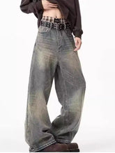 Men’s plus size wide-leg jeans in faded distressed gray wash with subtle color variations in denim material