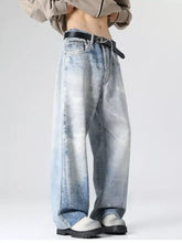 Men’s full size wash wide leg jeans in faded distressed blue denim with subtle white streaks front view