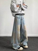 Men’s full size wash wide-leg jeans feature a faded gradient wash from light blue to beige in denim material
