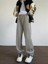 Men’s full size wash wide leg jeans in gray with relaxed fit and soft textured fabric featuring subtle stitching details