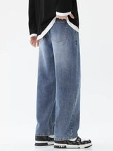 Men’s light-wash blue denim full size wash wide-leg jeans with relaxed wide-leg silhouette and visible stitching details
