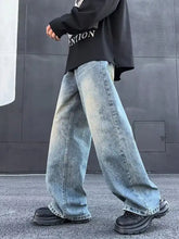 Men’s full size wash light-wash denim wide leg jeans with frayed hems in a wide leg cut design