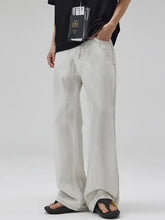 Men’s full size wash wide leg jeans in light-wash denim with a relaxed fit and visible stitching details