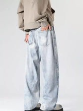 Men’s full size wash wide leg jeans in light-wash denim with a relaxed fit and subtle fading