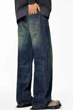 Men’s full size wash wide leg jeans plus size in washed blue denim with faded distressing and wide leg cut