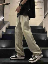 Men’s beige cargo pants with zipper side pockets and relaxed fit matching wide-leg jeans plus size wash style