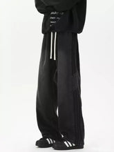 Men’s full size wash wide-leg jeans in black with white side stripes and thigh patch pocket featuring a tape measure detail