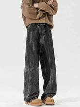 Men’s black wide-leg denim jeans with faded distressed texture and raw hem in full size wash relaxed fit plus size