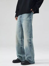 Men’s light-wash denim wide-leg jeans with a relaxed fit and subtle fading for a modern full size wash look