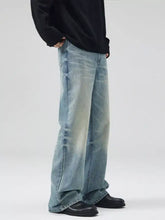 Men’s light-wash denim wide leg jeans with relaxed fit and slightly faded design in full size wash plus size