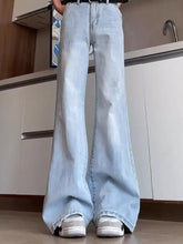 Men’s full size washed flare jeans in light-wash denim with subtle distressing and classic five-pocket design