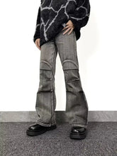 Men’s full size gray denim washed flare jeans with reinforced knee patches and a slightly worn distressed look