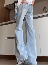 Men’s full size washed flare jeans in light wash denim showing classic back pocket design from the back side