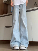 Men’s full size washed flare jeans in light-wash denim with subtle distressing details and plus size fit