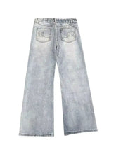 Men’s full size washed flare jeans in light-wash denim with a relaxed wide-leg cut and embroidered back pockets view