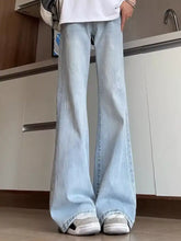 Men’s full size washed flare jeans in light wash denim with subtle distressing and a relaxed wide-leg cut