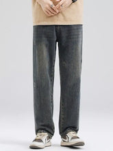 Men’s full size washed relaxed fit jeans in dark-wash denim with straight-leg cut and subtle vintage fading