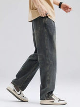 Men’s full size washed relaxed fit dark-wash denim jeans with a straight-leg cut and subtle distressed details
