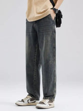 Men’s full size washed relaxed fit dark-wash denim jeans with a straight-leg cut and subtle fading front view