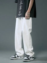 Men’s full size white cotton relaxed fit trousers with a loose, straight-leg cut for comfortable fit jeans style