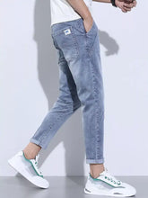 Men’s full size washed skinny jeans in light-wash denim with slim fit and rolled cuffs with pockets plus size
