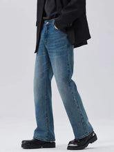 Men’s full size washed medium-wash blue denim straight leg jeans with classic five-pocket design full length