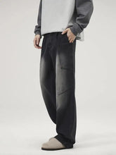 Men’s black denim washed wide leg baggy jeans plus size with faded distressed look and visible stitching details