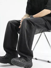 Men’s full size black wide leg denim jeans with faded wash and visible stitching details in plus size design
