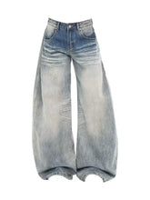 Men’s full size washed wide leg jeans in denim with faded distressed wash and subtle whiskering details