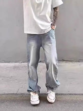 Men’s full size washed wide-leg jeans in light-wash denim with relaxed straight-leg cut and rolled cuffs