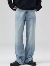 Men’s full size washed wide leg jeans in light-wash denim with a relaxed fit and subtle fading, front view