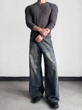 Dark gray ribbed long-sleeve henley shirt paired with men’s full size washed wide leg jeans for plus size fits