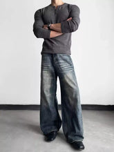 Men’s full size dark-wash denim wide leg jeans with faded distressing details and a relaxed wide leg cut