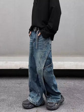 Men’s full size washed wide leg jeans in faded blue denim with diagonal seam detailing and a washed wide leg fit