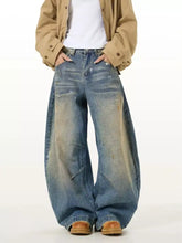 Men’s full size washed wide leg jeans in faded blue denim with distressed details and a relaxed fit design