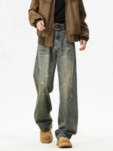 Men’s full size washed denim wide leg jeans with a faded distressed look and comfortable wide leg cut