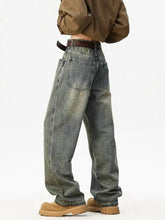 Men’s full size washed wide leg jeans in faded gray denim with visible stitching and a brown leather belt