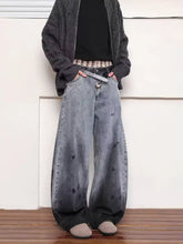 Mens full size washed wide leg jeans in faded gray to black denim with subtle heart-shaped distress marks