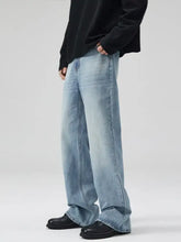 Men’s light-wash denim wide-leg jeans with relaxed fit and frayed hems in plus size full length design