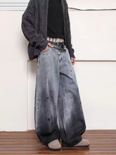 Men’s full size washed wide leg denim jeans with faded gray-to-black gradient and distressed details
