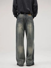 Men’s washed gray denim full size wide leg jeans with relaxed fit and faded distressing plus size