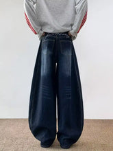 Men’s dark blue wide leg barrel jeans in denim with a relaxed fit and subtle white stitching details plus size