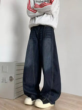 Men’s dark blue denim wide leg barrel jeans with relaxed fit and visible stitching details plus size full size