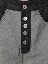 Men’s size wide leg gray denim shirt with black button placket and silver-toned buttons for versatile style