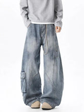 Men’s full size wide leg cargo jeans in faded blue denim with cargo pockets and visible stitching