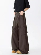 Men’s full size wide leg dark brown cargo jeans with multiple pockets and relaxed fit in denim material