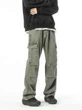 Men’s olive green full size wide leg cargo jeans with multiple flap leg cargo pockets and a relaxed fit design
