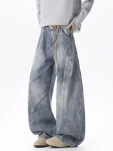 Men’s full size wide leg cargo jeans in faded blue denim with visible stitching and multiple cargo pockets